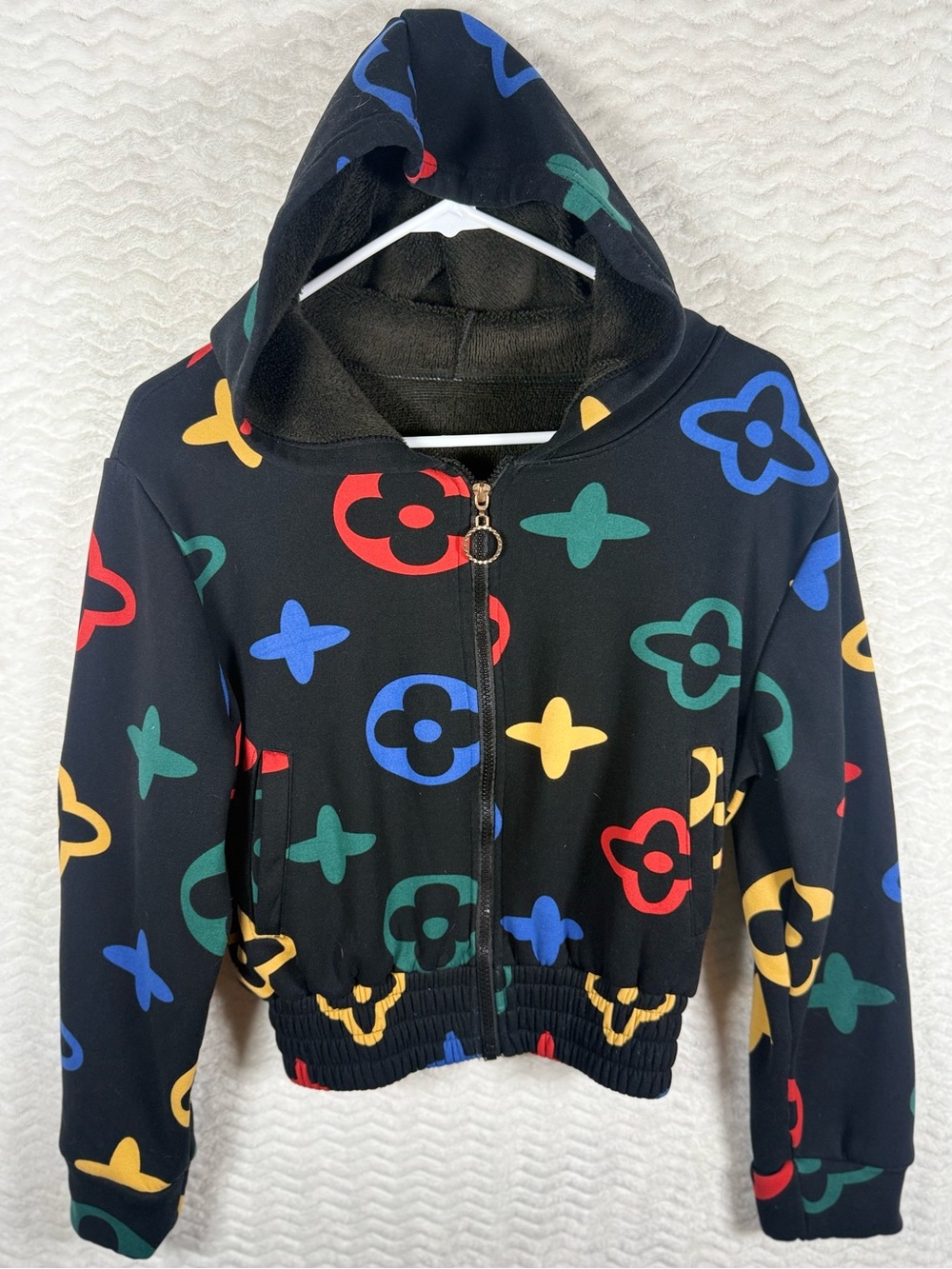 On chic Black Hooded Zip Jacket with Multicolor Fun Print. Soft inside 🤩🧡